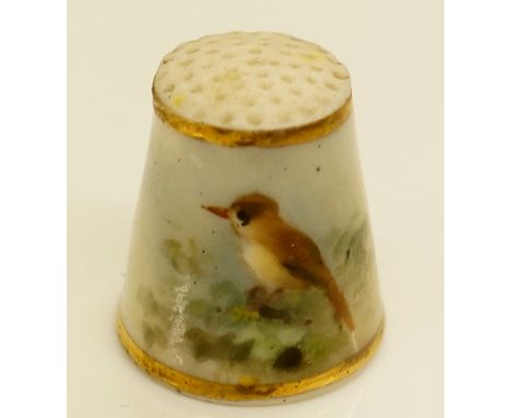 A Royal Worcester thimble painted with a bird by Powell, gilt line borders, 2.25cm high, printed mark in pink