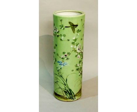 A Chinese Celadon porcelain cylindrical stick stand decorated overall with flowers, leafage and bird, 62cm high, 21cm diamete