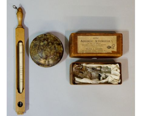 A wooden cased glass thermometer with turned handle and corked base, the papered register inscribed Dr Forbes Specifications,