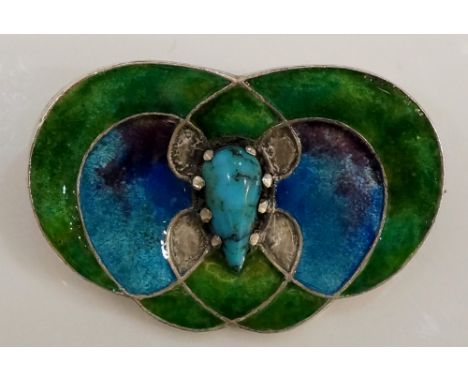 Liberty & Co. Ltd - an Arts & Crafts enamel brooch of interlaced coloured design centred on a pear shaped turquoise, brightly