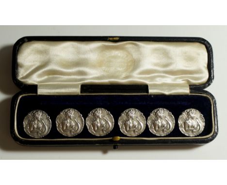 A good set of six Art Nouveau style silver buttons each shaped circular, embossed with a half length female figure playing a 