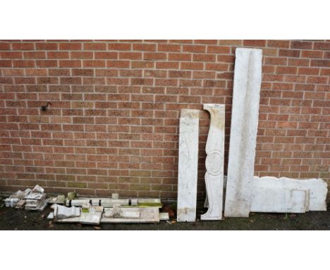 A Victorian grey veined carrara marble fireplace with serpentine shaped shelf above a pair of plain uprights and conforming f