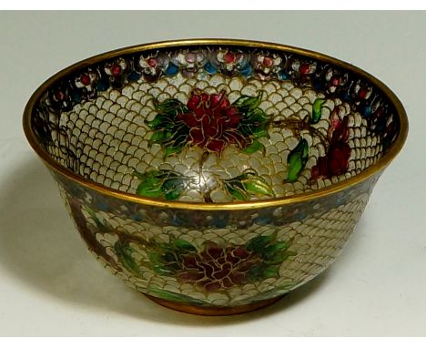A plique á jour enamel bowl the body finely worked in translucent enamels with flower heads and leafage on an opaque ground, 