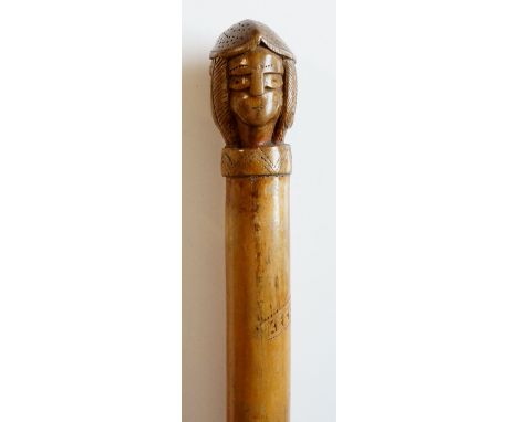 Keckuba ? - a walking stick of tapered form with quadruple head carved pommel, inscribed Keckuba, 91cm long