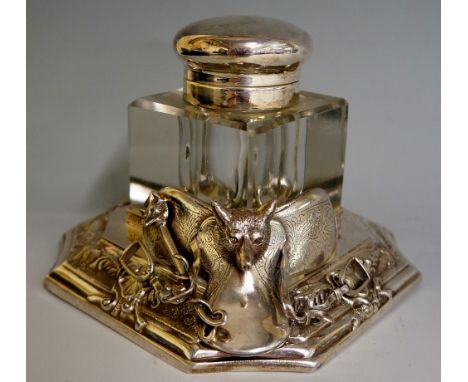 Hunting - a desk inkwell, the rectangular base with concave corners cast with a floral scroll and shell band one corner appli