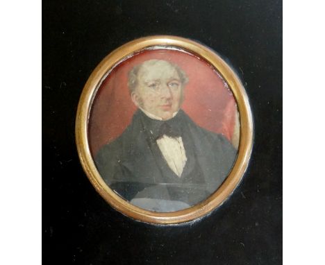 English School, mid 19th Century - head and shoulder portrait of a gentleman, 8.5cm x 7.5cm oval within gilded copper bezel a