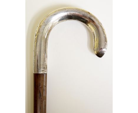 A Victorian silver topped walking stick with silver shepherd's crook section, slightly tapered triangular shaft, 90cm long, L