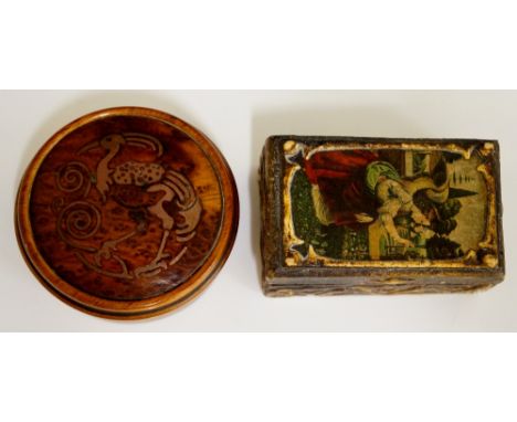 An interesting circular dressing table box the slightly domed top inlaid in copper with a stylised bird, 7cm diameter; a smal