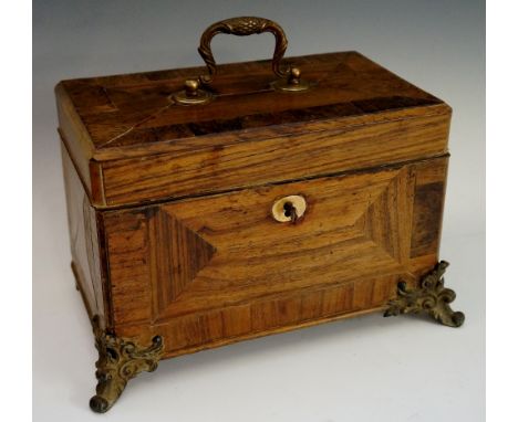 A George III rosewood veneered caddy the hinged top with cross banded border and swan-loop handle, the interior with three co