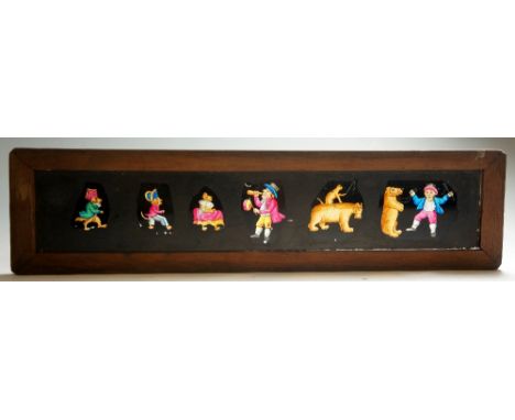 Eleven Victorian glass slides, variously hand decorated with humorous, hunting, bear baiting and other scenes, 7.75cm x 31cm,