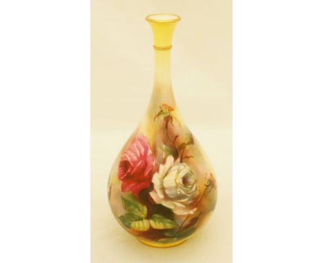 A Royal Worcester bottle shaped vase with tall neck, the body painted with white and pink rose blooms, roses and buds on a sh