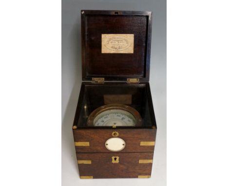 A mid 19th Century marine compass in a chronometer case, the rosewood case brass bound with pair of carrying handles the fron