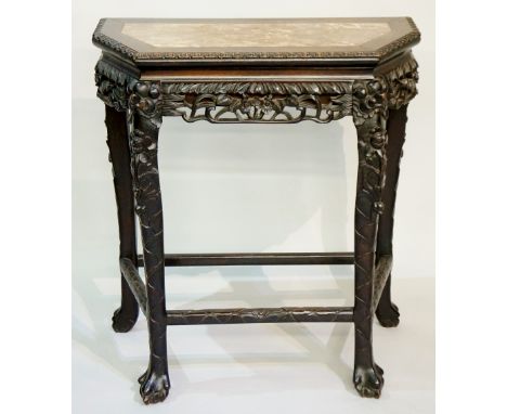 A good Chinese hardwood side table of splayed rectangular form the top inset with a rosso marble, the lip carved with bead an