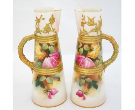 A pair of Royal Worcester jugs or ewers the tapered cylindrical bodies with reeded gilt bands and wrapped crab stock handles 