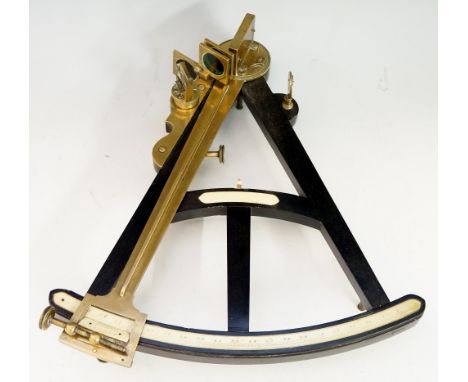 A late 18th Century brass mounted ebony octant with ivory scales, coloured glass lenses, 35cm x 29cm