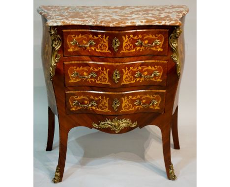 A Louis XVI style brass mounted small commode with rouge marble top the front fitted three serpentine drawers with foliate in