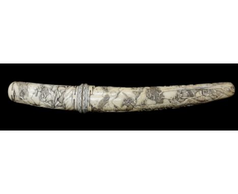 A Chinese ivory tanto dagger the handle and scabbard finely carved with warriors amidst extensive mountainous landscapes, 40c