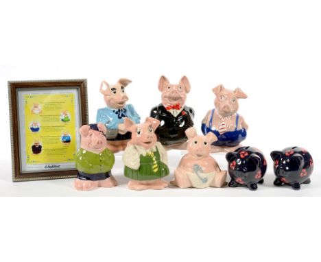 A SET OF EIGHT WADE NATWEST PIGGY BANKS, A RELATED FRAMED LEAFLET AND A FURTHER PAIR OF BANKS, DECORATED WITH NATWEST LOGO 