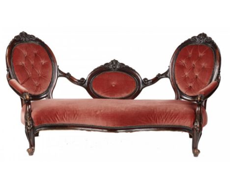 A VICTORIAN WALNUT TWIN CAMEO BACK SERPENTINE SOFA, C1870, carved with scrolling foliage,  mahogany stained, 100cm h; 80 x 19