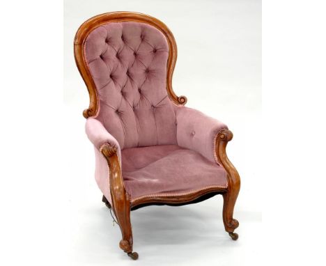 A VICTORIAN CARVED MAHOGANY ARMCHAIR, UPHOLSTERED IN BUTTON BACK FABRIC