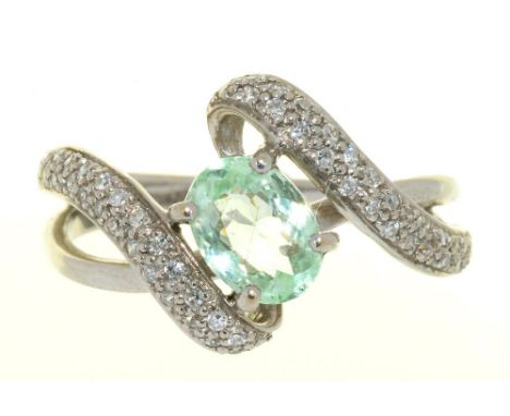 A PALE GREEN TOURMALINE AND PAVE DIAMOND RING, IN 18CT WHITE GOLD, MAKER R&amp;C, 4.5G, SIZE O++IN GOOD CONDITION 