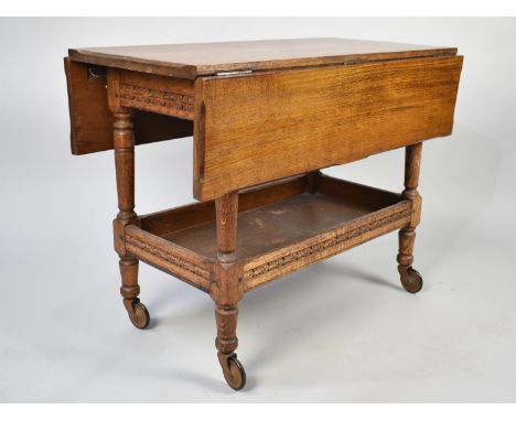 A Mid 20th Century Oak Drop Leaf Trolley with Galleried Stretcher Shelf and Carved Decoration , 82cms Long