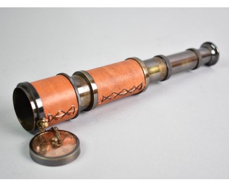 A Reproduction Brass Three Drawer Telescope with Leather Covered Body