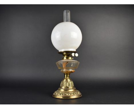 A Victorian Brass Based Oil Lamp with Plain Glass Reservoir, Opaque Glass Shade and Plain Chimney, Double Controls, 54cms Hig