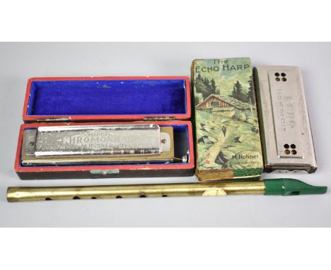 A Boxed Hohner Echo Harp, a Super Chromonica and an Irish Penny Whistle
