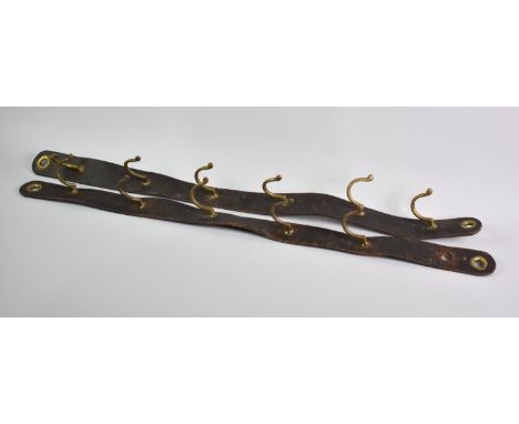A Pair of Leather and Brass Whip Hooks