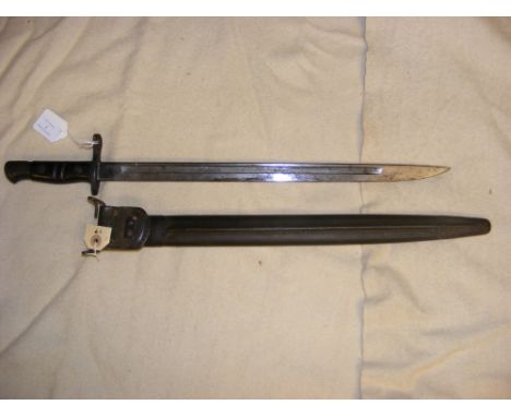 An American Remington bayonet with leather scabbard - overall length of bayonet 55cm 