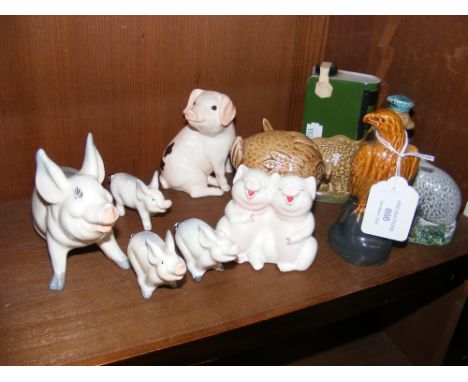 A collection of Beswick Ben Eagles Scotch Whiskey ornaments together with pig figures