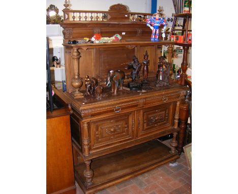 An ornately carved buffet with marble slab to top - width 128cm 