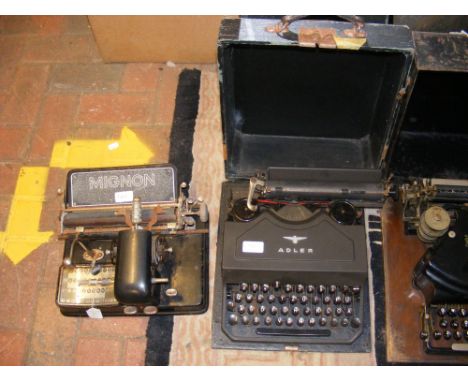 An Adler typewriter together with a Mignon typewriter