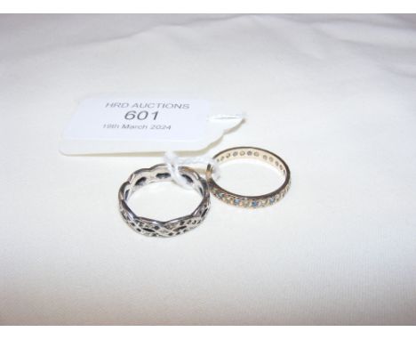 A decorative dress ring and one other
