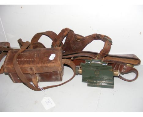 A Vickers clinometer Mk.II in leather case, together with a military leather belt 