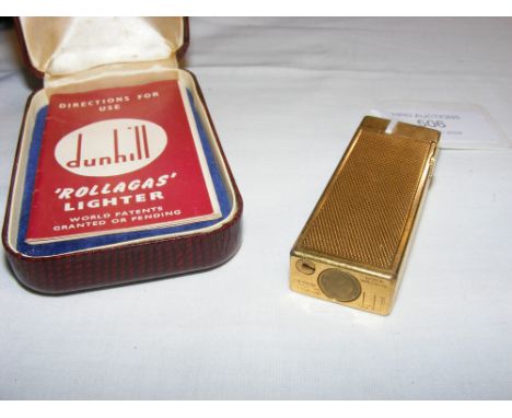 A Dunhill vintage lighter with original case and manual