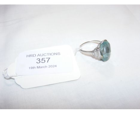 A platinum, diamond and aquamarine Art Deco style dress ring CONDITION REPORT Stone approximately 1.5cm long, 1cm wide and 0.