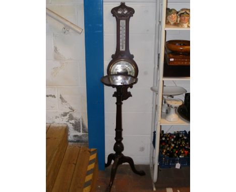 A mahogany pie crust plant stand, together with an oak cased barometer 