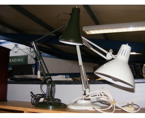 An Anglepoise lamp in black, together with one similar lamp 