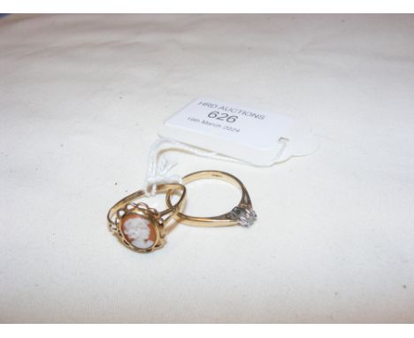 A diamond solitaire ring together with a cameo ring