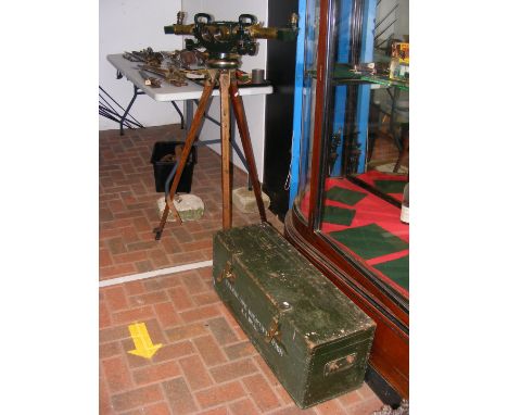 A Military Anti-Aircraft double ended telescope, the plaque engraved No. 4710-1943 on original tripod, having original carryi