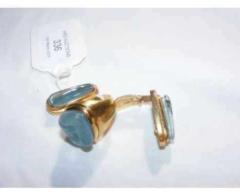 An 18ct gold (tested) Brazilian designer ring with pale blue stone mount with the matching 18ct gold earrings CONDITION REPOR