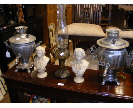 Two samovars together with an oil lamp and two 'composer' busts