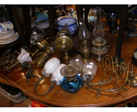Assorted wall lighting including gimbled brass oil lamps