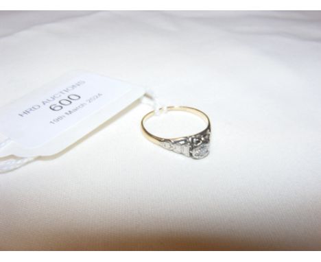 A diamond solitaire ring in gold setting