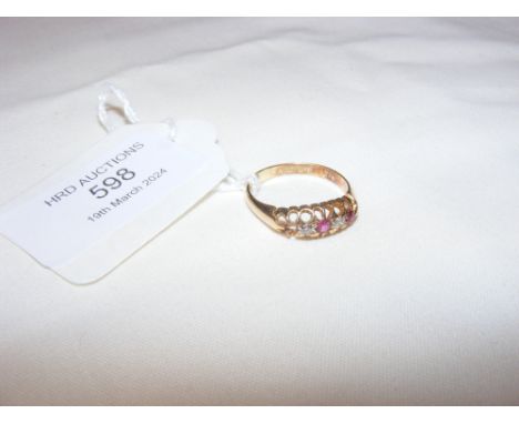 A diamond and ruby ring in 18ct setting