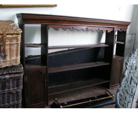 An antique oak hanging book shelf