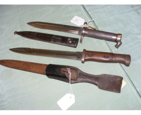 An EJ/AB bayonet in scabbard, together with one other bayonet 