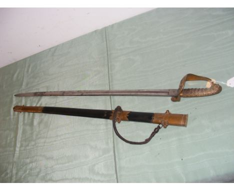 An antique naval sword with decorated brass guard and shagreen grip, having brass mounted leather scabbard - length of sword 